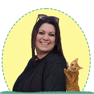 A photo of Maria smiling at the camera. The photo is a collage with that of a cat.