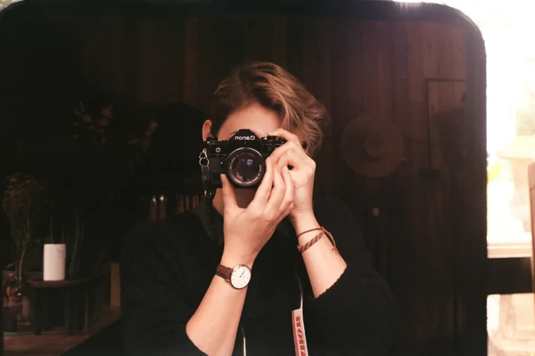 A person holding a camera.