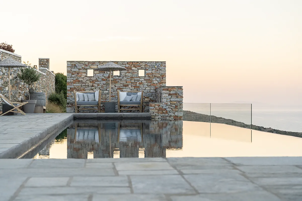 The pool area of a hotel at sunrise. Carefully utilised, the natural light adds to the beauty of the moment, proving the importance of professional hotel photography.